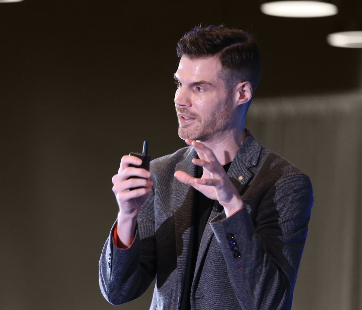 Brian Quimby presenting on stage
